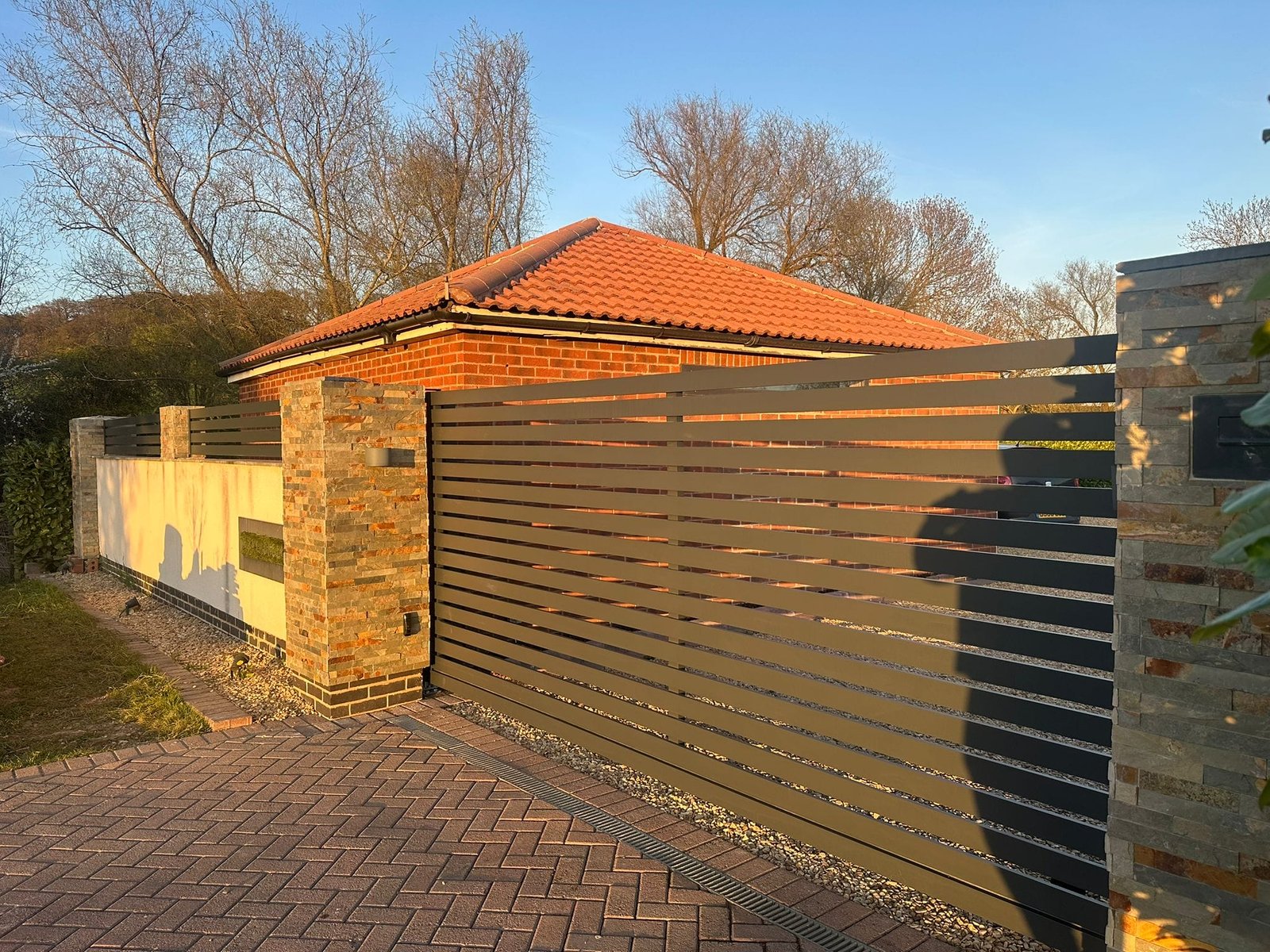 Completed AlumaGates metal garage with wood-effect finish